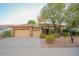 Beautiful home exterior with a welcoming front porch and mature landscaping at 2740 S Honeysuckle Ln, Gilbert, AZ 85295