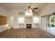 Bright living room with fireplace and built-in shelving at 2740 S Honeysuckle Ln, Gilbert, AZ 85295