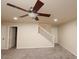 Spacious living area with neutral decor and ceiling fan at 2740 S Honeysuckle Ln, Gilbert, AZ 85295