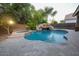 Inviting pool with a spa, waterfall, and flagstone patio at 2740 S Honeysuckle Ln, Gilbert, AZ 85295