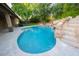 Stunning pool with a rock waterfall and built-in spa at 2740 S Honeysuckle Ln, Gilbert, AZ 85295