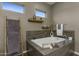 Relaxing bathroom with soaking tub and contemporary tile at 28219 N Needle Rock Ct, Rio Verde, AZ 85263