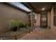 Private courtyard entry with brick pavers and potted plants at 28219 N Needle Rock Ct, Rio Verde, AZ 85263