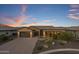 Single-story home with a two-car garage and landscaped yard at 28219 N Needle Rock Ct, Rio Verde, AZ 85263