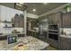 Modern kitchen with stainless steel appliances and granite countertops at 28219 N Needle Rock Ct, Rio Verde, AZ 85263