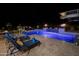 Illuminated pool and patio with lounge chairs at 28219 N Needle Rock Ct, Rio Verde, AZ 85263