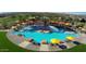 Large resort-style pool with plenty of lounge chairs and shade structures at 28219 N Needle Rock Ct, Rio Verde, AZ 85263