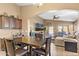 Kitchen dining area with table and chairs, open to the Gathering room at 2910 E Quiet Hollow Ln, Phoenix, AZ 85024