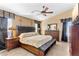 Main bedroom with a king-size bed and an ensuite bathroom at 2910 E Quiet Hollow Ln, Phoenix, AZ 85024