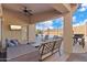 Covered patio with seating area, overlooking pool at 2910 E Quiet Hollow Ln, Phoenix, AZ 85024