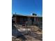 House exterior requiring renovation, with a chain link fence at 299 N Fresno St, Chandler, AZ 85225