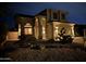 Two-story house with desert landscaping at night at 3055 N Red Mountain Rd # 149, Mesa, AZ 85207