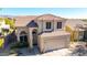 Two-story house with tile roof and a two-car garage at 3055 N Red Mountain Rd # 149, Mesa, AZ 85207