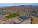 Aerial view of community with park, tennis courts, and pickleball courts at 3055 N Red Mountain Rd # 149, Mesa, AZ 85207