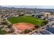 Aerial view of community park with baseball field and open green space at 3055 N Red Mountain Rd # 149, Mesa, AZ 85207