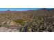 Aerial view of community with a winding road and numerous houses at 3055 N Red Mountain Rd # 149, Mesa, AZ 85207