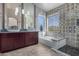 Spa-like bathroom with double vanity, large shower, and patterned tile at 3055 N Red Mountain Rd # 149, Mesa, AZ 85207