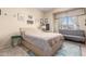 Bright bedroom with a comfortable bed and built-in seating at 3055 N Red Mountain Rd # 149, Mesa, AZ 85207