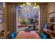 Bright dining room with large window, chandelier, and wooden table at 3055 N Red Mountain Rd # 149, Mesa, AZ 85207