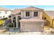 Two-story house with tan exterior and tile roof at 3055 N Red Mountain Rd # 149, Mesa, AZ 85207