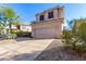 Two-story house with attached garage and desert landscaping at 3055 N Red Mountain Rd # 149, Mesa, AZ 85207