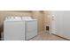 Laundry room with washer, dryer, and pet door at 3055 N Red Mountain Rd # 149, Mesa, AZ 85207