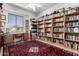 Home library with extensive built-in bookshelves at 3055 N Red Mountain Rd # 149, Mesa, AZ 85207