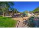 Community playground with covered pavilion, play structures, and sand area at 3055 N Red Mountain Rd # 149, Mesa, AZ 85207