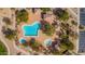 Aerial view of community pool, spa, and surrounding landscape at 3055 N Red Mountain Rd # 149, Mesa, AZ 85207