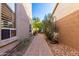 Brick pathway through a desert landscape side yard at 3055 N Red Mountain Rd # 149, Mesa, AZ 85207