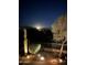 Night view of backyard with mountain backdrop at 3055 N Red Mountain Rd # 149, Mesa, AZ 85207