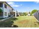 Large backyard with a grassy lawn and privacy wall at 3606 W Le Marche Ave, Phoenix, AZ 85053