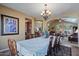 Elegant dining room with a view of the living room at 3606 W Le Marche Ave, Phoenix, AZ 85053