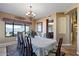 Formal dining room with chandelier and large windows at 3606 W Le Marche Ave, Phoenix, AZ 85053