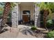 Elegant entryway with stone pillars and double doors at 3606 W Le Marche Ave, Phoenix, AZ 85053