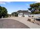 Two-story home with three-car garage and large driveway at 3606 W Le Marche Ave, Phoenix, AZ 85053