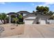 Two-story home with three-car garage and desert landscaping at 3606 W Le Marche Ave, Phoenix, AZ 85053