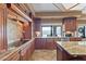 Large kitchen with granite countertops and a view of the backyard at 3606 W Le Marche Ave, Phoenix, AZ 85053