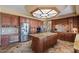 Spacious kitchen with granite island and custom cabinetry at 3606 W Le Marche Ave, Phoenix, AZ 85053