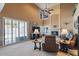 Living room with high ceilings, fireplace, and large windows at 3606 W Le Marche Ave, Phoenix, AZ 85053