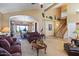 Living room with high ceilings and views into dining area at 3606 W Le Marche Ave, Phoenix, AZ 85053