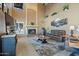 Living room with high ceilings, fireplace and large windows at 3606 W Le Marche Ave, Phoenix, AZ 85053