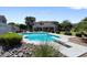 Inviting swimming pool with diving board, surrounded by a well-landscaped backyard at 3606 W Le Marche Ave, Phoenix, AZ 85053