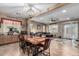 Open concept dining area with a rustic wooden table and seating at 36248 W Cartegna Ln, Maricopa, AZ 85138