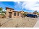 Two-story home with a landscaped yard and attached two car garage at 36248 W Cartegna Ln, Maricopa, AZ 85138