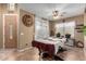 Bright game room features a pool table and plenty of natural light at 36248 W Cartegna Ln, Maricopa, AZ 85138