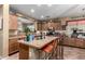 Well-equipped kitchen featuring stainless steel appliances and tile countertops at 36248 W Cartegna Ln, Maricopa, AZ 85138