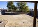 Large backyard with dirt and small trees at 36285 N Mirandesa Dr, San Tan Valley, AZ 85143