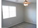 Well-lit bedroom featuring a ceiling fan and window blinds at 36285 N Mirandesa Dr, San Tan Valley, AZ 85143