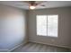 Bright bedroom with ceiling fan and window blinds at 36285 N Mirandesa Dr, San Tan Valley, AZ 85143